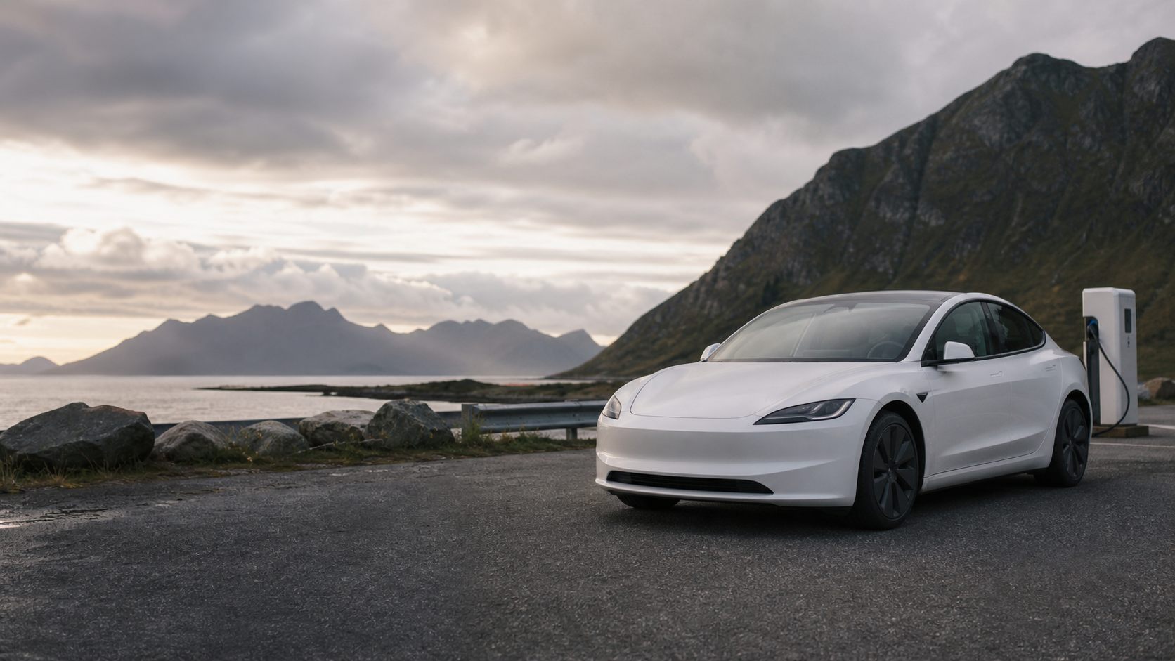 White electric car at a Norwegian fjord charging stop
